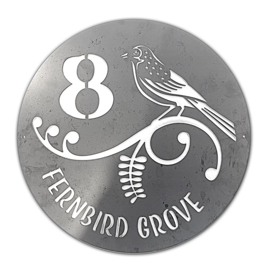 Round custom metal house sign with a bird and fern design, number 8 and Fernbird Grove wording